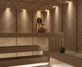 a woman sitting in a sauna in a wooden sauna