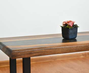 red flower on blue ceramic vase on brown wooden table
