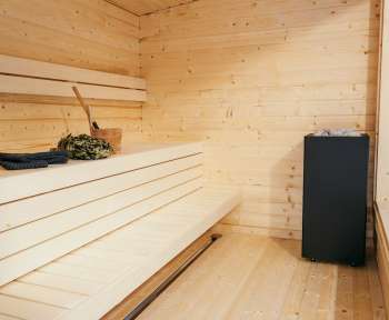 a room with a wood floor and a wood wall with a black box