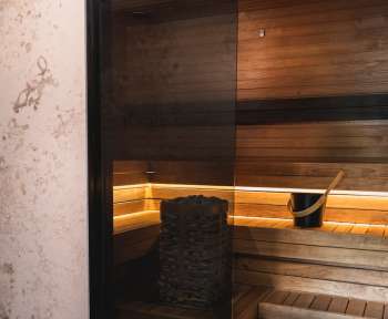 a sauna room with a sauna in the middle of it